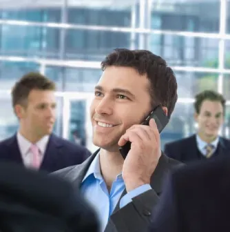 Businessman smiling while on a phone call